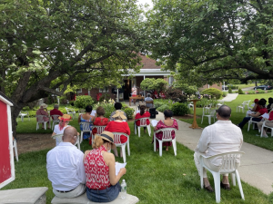People attending an outdoor church service