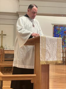 Jeffrey Kist at the lectern leading prayers