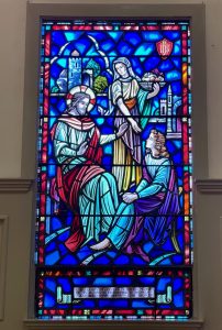 Stained glass window depicting Mary & Martha with Jesus